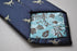navy blue tie with t-rex dinosaur print design